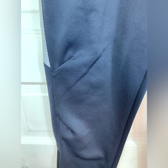 Reebok Dark Gray Stretchy Soft Track Pants. 3 pockets.  Zippers at leg base. - Picture 7 of 13